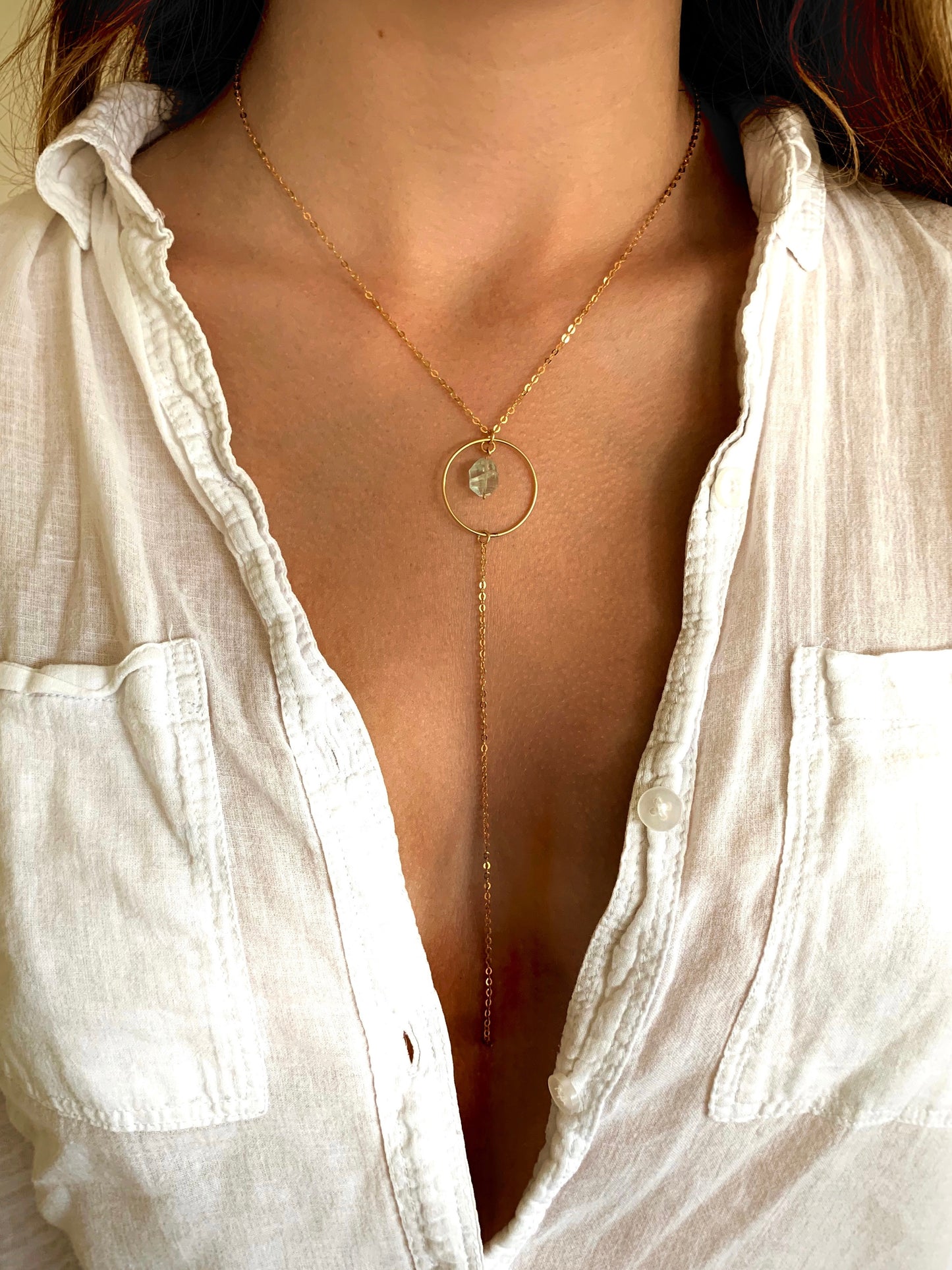 Eden necklace, aquamarine and gold necklace, blue aquamarine necklace in gold on model wearing white button up