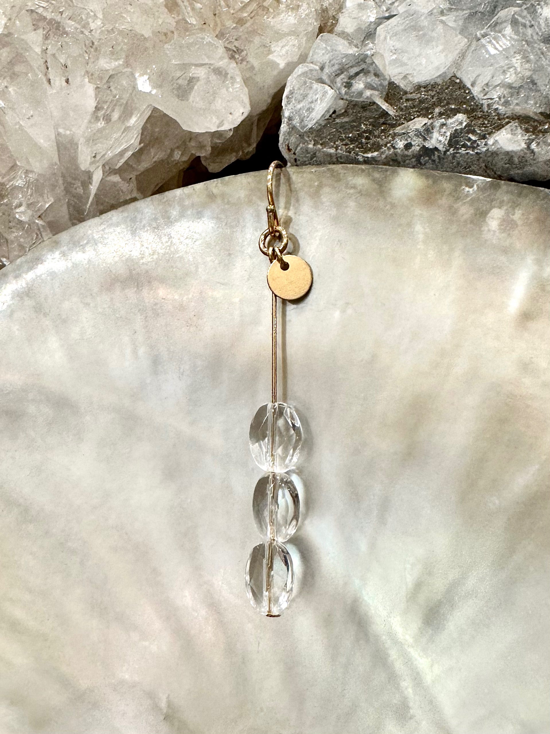 Trinity drop earrings, quartz earrings, gold crystal drop earrings on shell
