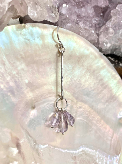 Helena drop earrings, amethyst teardrop earrings, sterling silver amethyst earrings close-up on shell