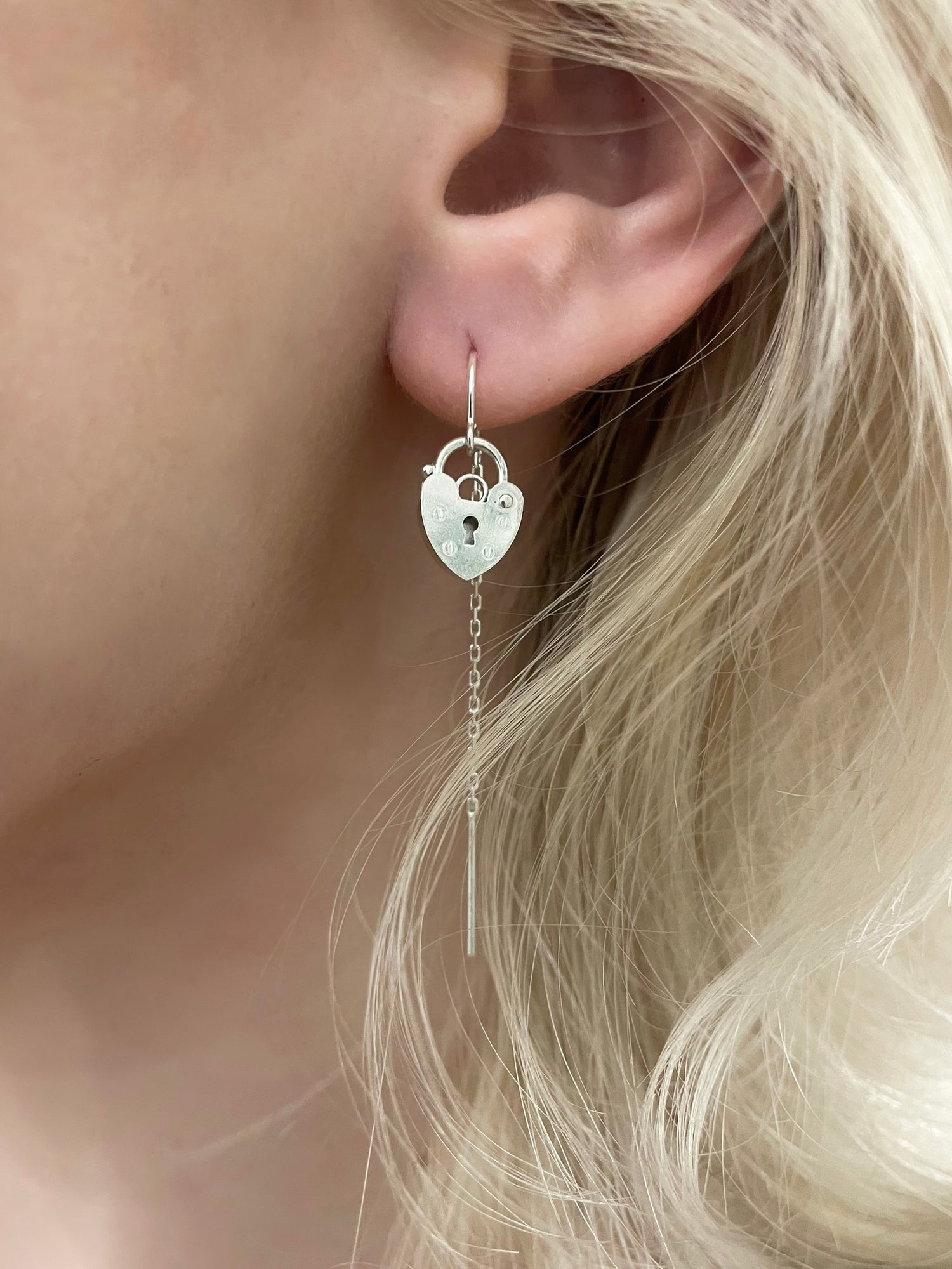 Tesoro padlock thread earrings, padlock earrings, earrings on model